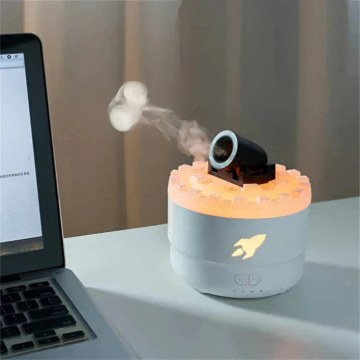 Cannon diffuser emitting mist beside a laptop, eco-friendly PP material.